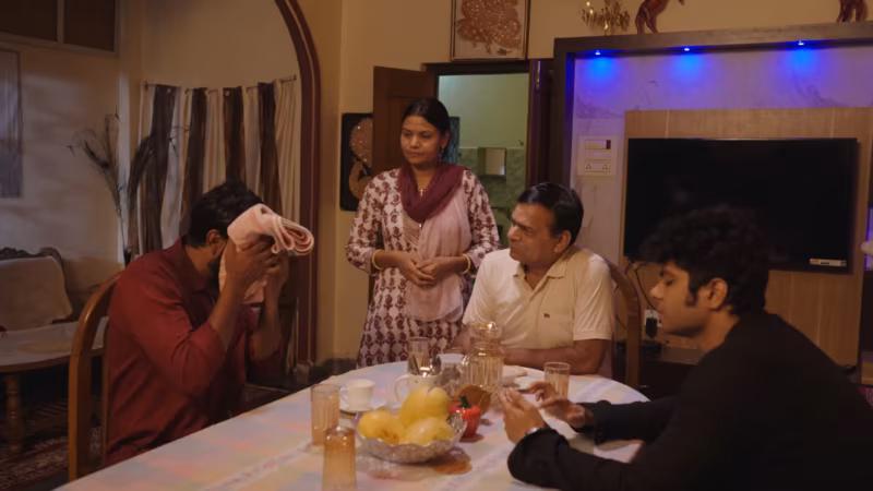 The family gathered around the dinner table in the front room