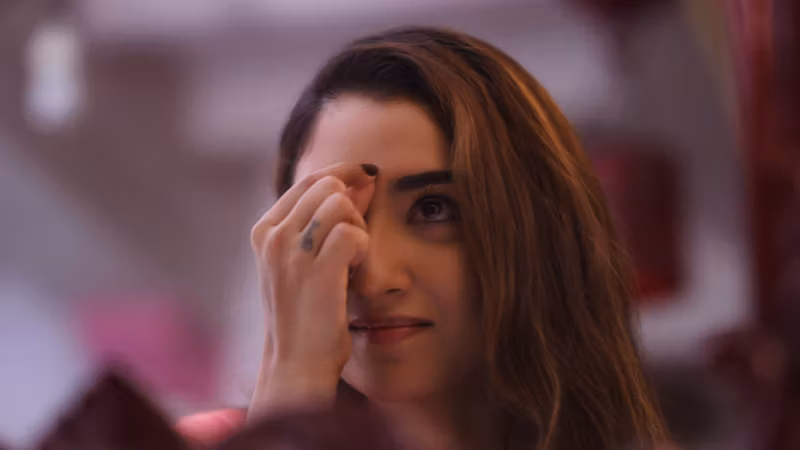 A still from Bahut Khoobsurat Ho Tum: a close shot of a woman, her hand raised to her face