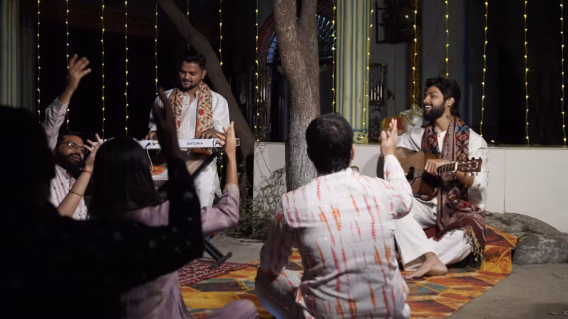 A still from Mere Dil Mein Bhole Baba: musicians and singers performing together under festive lights